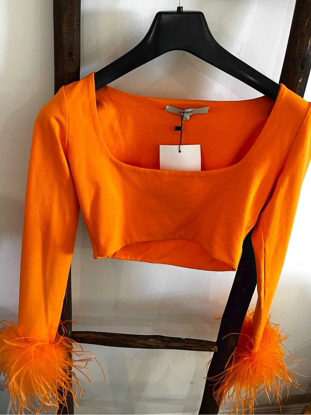 Manurí Orange Feather-Cuff Women's Crop Top